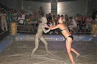 Sport and Fitness: bikini girls mud wrestling