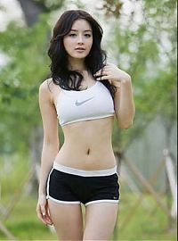 Sport and Fitness: young sport girl wearing a sports bra