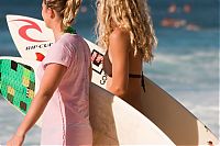 Sport and Fitness: young surfing girl