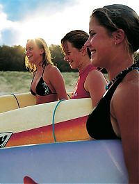 Sport and Fitness: young surfing girl