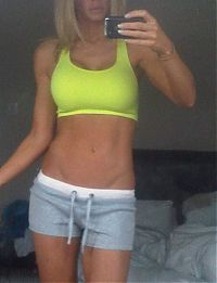 Sport and Fitness: young sport girl wearing a sports bra