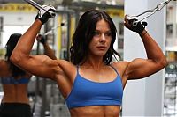 Sport and Fitness: strong fitness bodybuilding girl with abdominal six-pack belly muscles