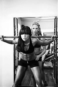 Sport and Fitness: strong fitness bodybuilding girl with abdominal six-pack belly muscles