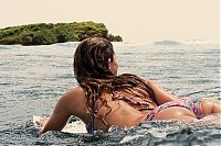 Sport and Fitness: young surfing girl