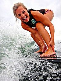 Sport and Fitness: young surfing girl