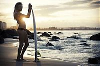 Sport and Fitness: young surfing girl