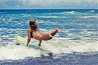 Sport and Fitness: young surfing girl