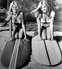 Sport and Fitness: young surfing girl