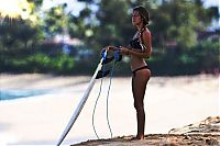 Sport and Fitness: young surfing girl