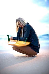 Sport and Fitness: young surfing girl