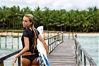 Sport and Fitness: young surfing girl