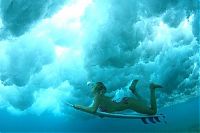 Sport and Fitness: young surfing girl