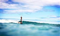 Sport and Fitness: young surfing girl