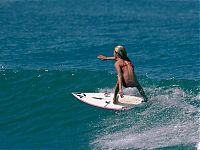 Sport and Fitness: young surfing girl