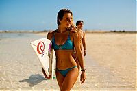 Sport and Fitness: young surfing girl