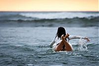 Sport and Fitness: young surfing girl