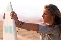 Sport and Fitness: young surfing girl