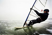 Sport and Fitness: ice windsurfing on a frozen lake