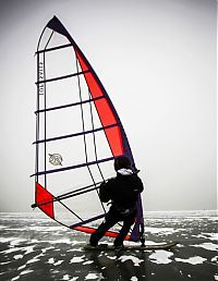 Sport and Fitness: ice windsurfing on a frozen lake