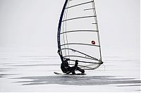 Sport and Fitness: ice windsurfing on a frozen lake