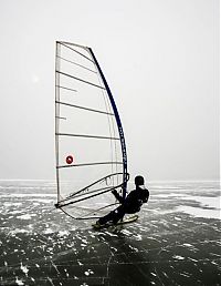 Sport and Fitness: ice windsurfing on a frozen lake