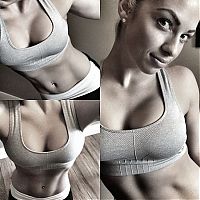 Sport and Fitness: strong fitness bodybuilding girl with abdominal six-pack belly muscles