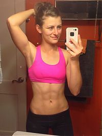 strong fitness bodybuilding girl with abdominal six-pack belly muscles