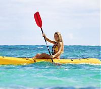 Sport and Fitness: girl with a kayak