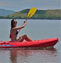 Sport and Fitness: girl with a kayak