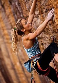 Sport and Fitness: young rock climbing girl