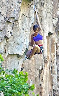 Sport and Fitness: young rock climbing girl