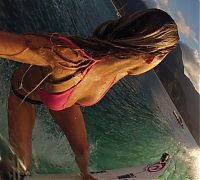 Sport and Fitness: young surfing girl