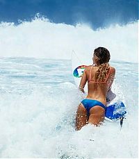 Sport and Fitness: young surfing girl