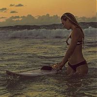 Sport and Fitness: young surfing girl