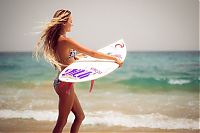 Sport and Fitness: young surfing girl