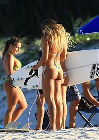 Sport and Fitness: young surfing girl