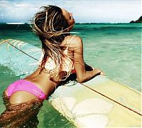 Sport and Fitness: young surfing girl