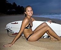 Sport and Fitness: young surfing girl