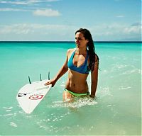 Sport and Fitness: young surfing girl