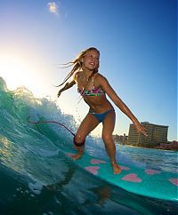 Sport and Fitness: young surfing girl