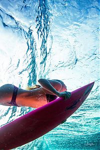 Sport and Fitness: young surfing girl