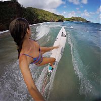 Sport and Fitness: young surfing girl