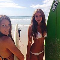 Sport and Fitness: young surfing girl