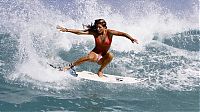 Sport and Fitness: young surfing girl