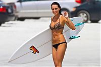 Sport and Fitness: young surfing girl