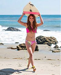 Sport and Fitness: young surfing girl