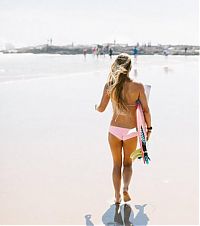 Sport and Fitness: young surfing girl