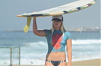 Sport and Fitness: young surfing girl