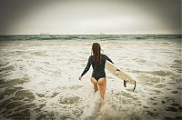 Sport and Fitness: young surfing girl