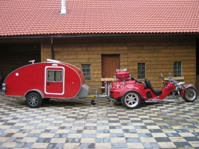 motorcycle with light travel trailer